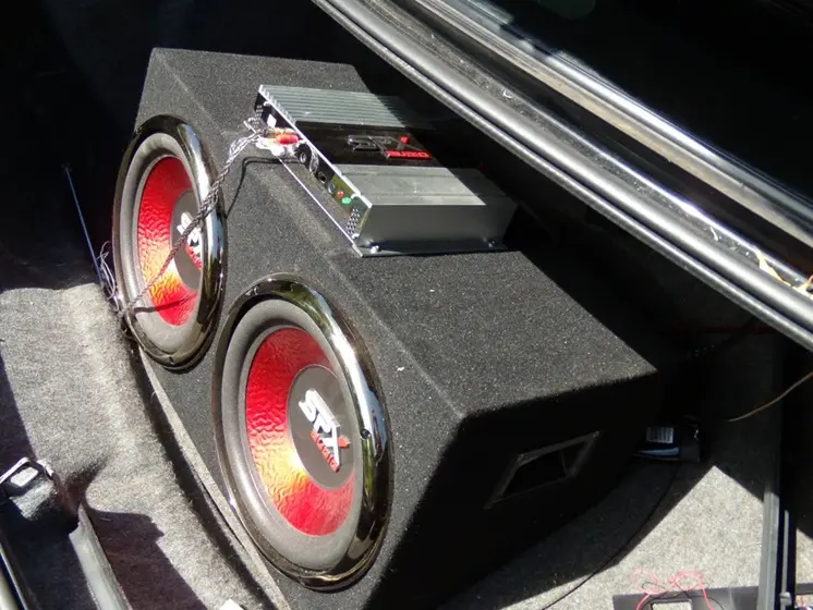 Custom sound system installed in a modern car trunk.